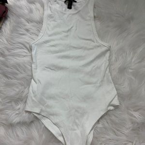 High neck white bodysuit.
